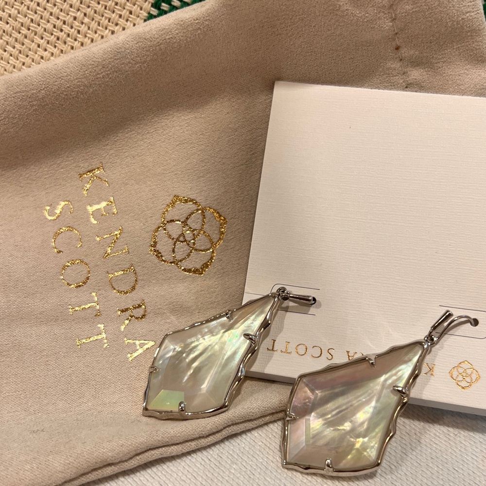 Kendra Scott silver mother of pearl earrings.